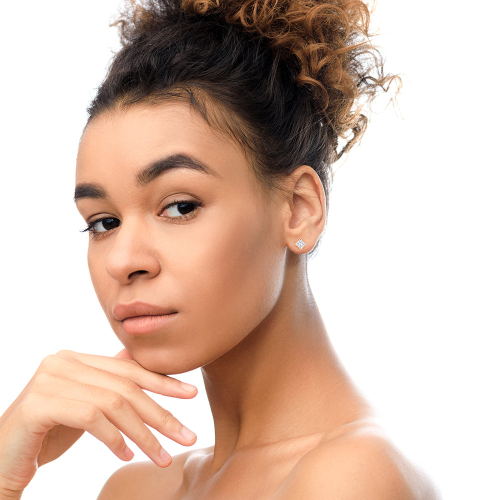 Princess-cut diamond studs worn by model