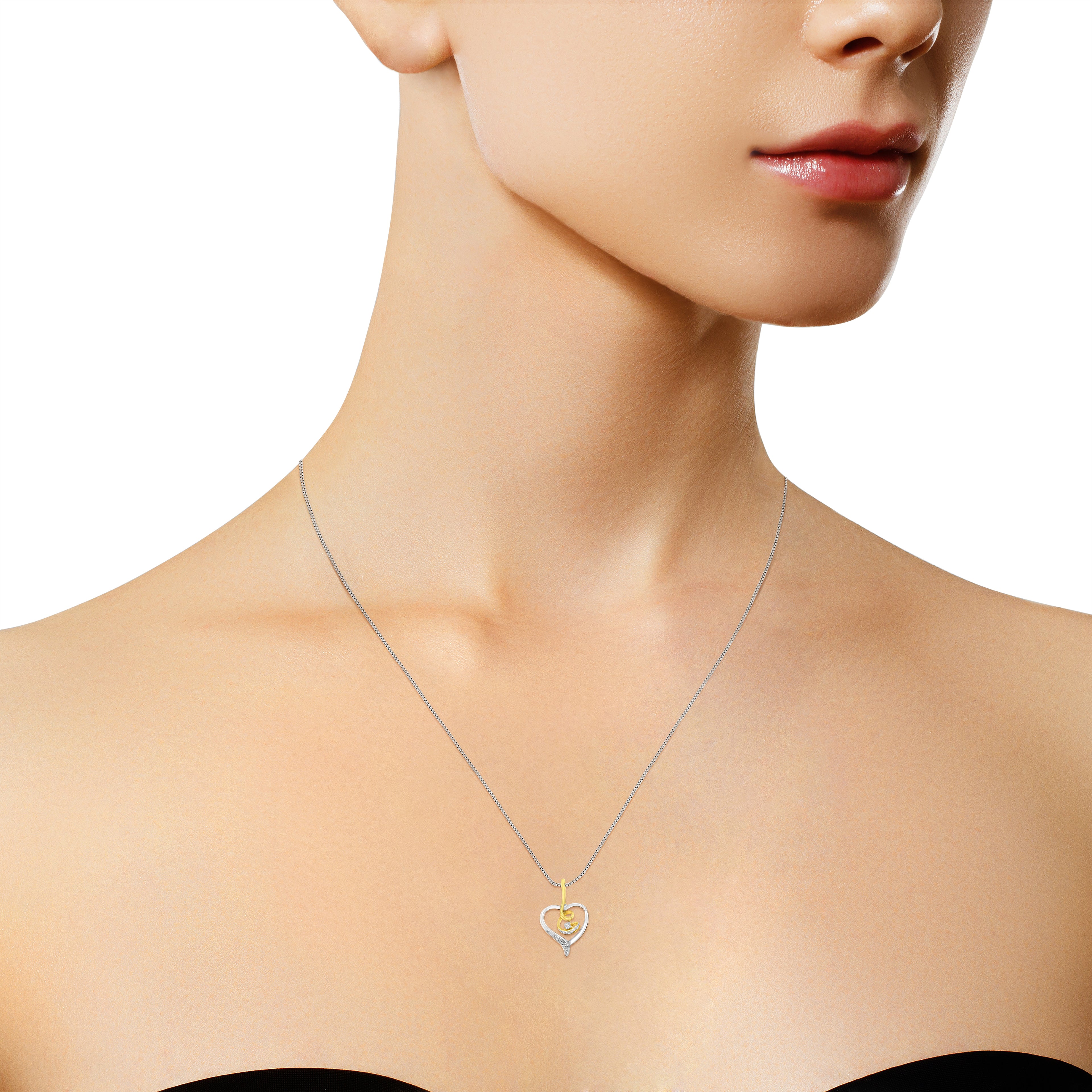 Two-tone heart necklace worn by model