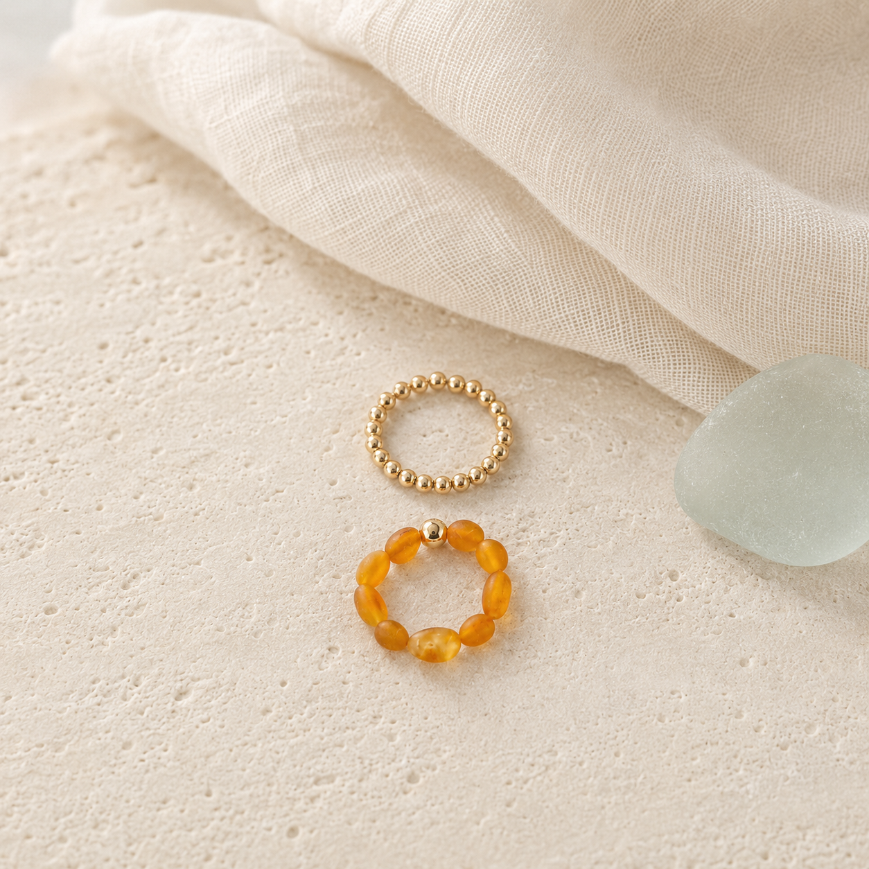 Baltic amber and 14K gold-filled ring stack in Mare & Gold coastal styling